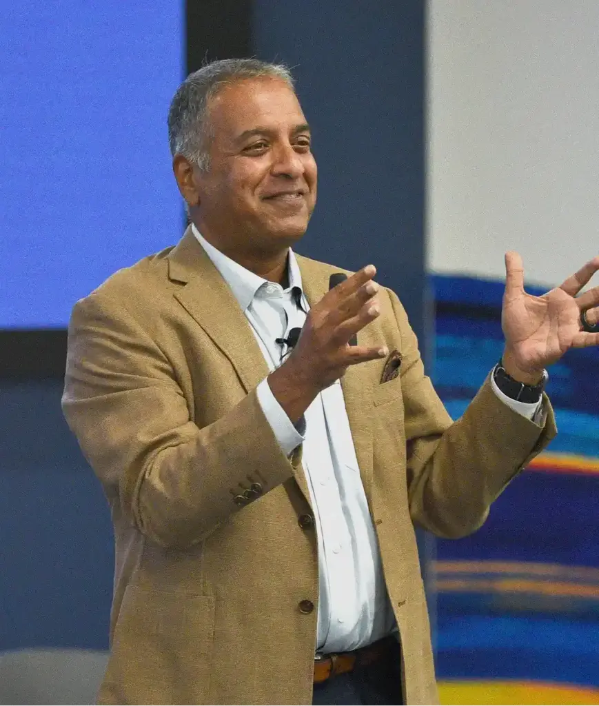 Free Guide 1 Rajeev Kapur speaking at AI conference